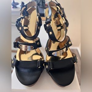 Michael Kors: embellished gold blocked heel open toe strap.